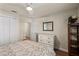 Comfortable bedroom featuring a ceiling fan, closet, and ample storage space, creating a functional and inviting space at 7628 Bay Port Rd # 43, Orlando, FL 32819