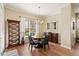 Cozy dining room with hardwood flooring, decorative chandelier, and bright natural light at 7628 Bay Port Rd # 43, Orlando, FL 32819
