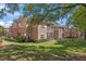 Beautiful condo building exterior with well-maintained lawns and mature trees at 7628 Bay Port Rd # 43, Orlando, FL 32819