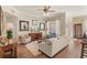 Cozy living room features hardwood flooring, neutral paint, lots of natural light and comfortable seating at 7628 Bay Port Rd # 43, Orlando, FL 32819