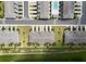 Aerial view showcasing new townhomes with manicured landscaping and community at 812 Driving Range Ct, Reunion, FL 34747