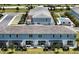 Birds eye view of townhomes with backyard patios and a community pool at 812 Driving Range Ct, Reunion, FL 34747