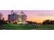 Scenic building view with a golf course at sunset; a beautiful place to live or vacation at 812 Driving Range Ct, Reunion, FL 34747