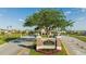 Main entrance into Reunion Resort, lush landscaping, and the Reunion sign at 812 Driving Range Ct, Reunion, FL 34747