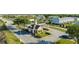 Well-manicured entrance to the community with guardhouse and landscaping at 812 Driving Range Ct, Reunion, FL 34747