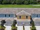 Charming townhomes feature colorful exteriors and individual garages with lovely landscaping at 812 Driving Range Ct, Reunion, FL 34747
