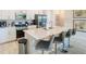 Modern kitchen with stainless steel appliances, quartz counters, and a spacious island at 812 Driving Range Ct, Reunion, FL 34747