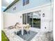 A patio area with a table and chairs is visible through the sliding glass doors at 812 Driving Range Ct, Reunion, FL 34747