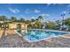 Large rectangular pool with brick patio and plentiful lounge chairs provides a tranquil space at 812 Driving Range Ct, Reunion, FL 34747