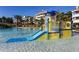 Fun water play area with a slide and various water features for entertainment at 812 Driving Range Ct, Reunion, FL 34747
