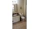 Bathroom with granite countertop vanity and sink, tile floors, a toilet, and a shower and tub with curtain at 8447 Crystal Cove Loop # 8447, Kissimmee, FL 34747