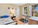 Relaxing bedroom provides a comfortable single bed, desk and two windows with views at 8447 Crystal Cove Loop # 8447, Kissimmee, FL 34747