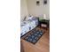Bedroom showcasing a modern design and natural light, complete with wooden floors and a desk at 8447 Crystal Cove Loop # 8447, Kissimmee, FL 34747
