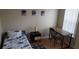 Bedroom showcasing a modern design and natural light, complete with wooden floors and a desk at 8447 Crystal Cove Loop # 8447, Kissimmee, FL 34747