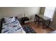 Bedroom showcasing a wooden desk, chair, and natural light, perfect for a study or relaxation at 8447 Crystal Cove Loop # 8447, Kissimmee, FL 34747
