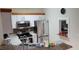 Kitchen featuring stainless steel appliances, white cabinetry and granite countertops with stainless steel sink and backsplash at 8447 Crystal Cove Loop # 8447, Kissimmee, FL 34747
