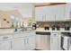 Bright kitchen featuring stainless steel appliances, white cabinets, and view to open living space at 8447 Crystal Cove Loop # 8447, Kissimmee, FL 34747