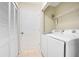Convenient laundry room with washer, dryer and folding closet with ample storage at 8447 Crystal Cove Loop # 8447, Kissimmee, FL 34747