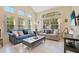 Spacious living room with plenty of natural light, tile flooring, and cozy seating at 8447 Crystal Cove Loop # 8447, Kissimmee, FL 34747
