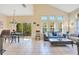 Bright living room with tile flooring, vaulted ceilings, and abundant natural light at 8447 Crystal Cove Loop # 8447, Kissimmee, FL 34747