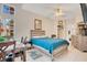 This main bedroom features a bed with a blue cover, a closet, and tile flooring at 8447 Crystal Cove Loop # 8447, Kissimmee, FL 34747