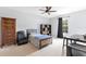 Comfortable bedroom with a ceiling fan, neutral walls, carpeted floor, and a full-size bed at 8676 Currituck Sound Ln, Orlando, FL 32829