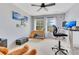 Cozy bedroom/office featuring two large windows, a loft bed, and an office setup at 8676 Currituck Sound Ln, Orlando, FL 32829
