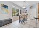 View of dining room and kitchen area with decorative liquor rack at 8676 Currituck Sound Ln, Orlando, FL 32829