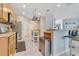Open concept kitchen features stainless steel appliances and a movable island at 8676 Currituck Sound Ln, Orlando, FL 32829
