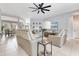 Open-concept living room featuring tile floors, contemporary furnishings, and plenty of natural light at 8676 Currituck Sound Ln, Orlando, FL 32829