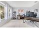 Bright office space with tile floors, two large windows, and built-in shelving units at 8676 Currituck Sound Ln, Orlando, FL 32829