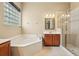 Bright bathroom with a soaking tub, a separate shower, and a single vanity at 9843 Nokay Dr, Orlando, FL 32836