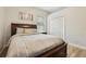 Bedroom with neutral colors, a wood-look bed frame, and a closet at 9843 Nokay Dr, Orlando, FL 32836