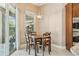 Cozy dining area next to sliding glass doors with backyard and natural light at 9843 Nokay Dr, Orlando, FL 32836