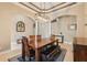 Spacious dining area showcases a wooden table, a decorative rug, modern light fixture, and plenty of seating at 9843 Nokay Dr, Orlando, FL 32836