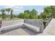 Waterfront dock featuring a built-in bench, idyllic setting for relaxation and enjoying tranquil lake views at 9843 Nokay Dr, Orlando, FL 32836