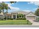 Charming single-story home with lush landscaping, stone accents, and a spacious three-car garage at 9843 Nokay Dr, Orlando, FL 32836
