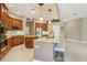 Open kitchen boasts stainless steel appliances, granite countertops and center island with seating at 9843 Nokay Dr, Orlando, FL 32836