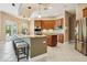 Spacious kitchen featuring an island with seating, stainless steel appliances, and ample storage at 9843 Nokay Dr, Orlando, FL 32836