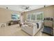 Comfortable living room with a large window, plush sofa, and a ceiling fan at 9843 Nokay Dr, Orlando, FL 32836