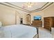 The large main bedroom has neutral walls, tray ceilings, closet access and tile flooring at 9843 Nokay Dr, Orlando, FL 32836