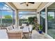 Charming screened patio featuring a dining area, lush landscaping, and relaxing outdoor ambiance at 9843 Nokay Dr, Orlando, FL 32836