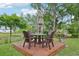 Outdoor dining on a wooden deck offers a charming space with views of the lake and surrounding nature at 9843 Nokay Dr, Orlando, FL 32836
