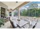 Inviting screened patio features comfortable seating and lush landscaping, creating an ideal outdoor living space at 9843 Nokay Dr, Orlando, FL 32836