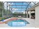 Relaxing screened lanai boasts a beautiful pool and sun loungers, perfect for enjoying the Florida lifestyle at 9843 Nokay Dr, Orlando, FL 32836