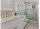 Modern bathroom with double sinks, shower, and stylish fixtures at 10124 Pink Carnation Ct, Orlando, FL 32825