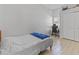 Well-lit bedroom with a comfortable bed, workspace desk, and closet at 10124 Pink Carnation Ct, Orlando, FL 32825
