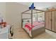 Comfortable bedroom featuring a four-poster bed, bright natural light, and ample closet space at 10124 Pink Carnation Ct, Orlando, FL 32825