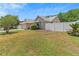 Charming home with a well-manicured front yard, mature trees, and inviting curb appeal at 10124 Pink Carnation Ct, Orlando, FL 32825