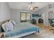 Bedroom with a king bed, sliding glass doors to the lanai, and an ensuite bathroom at 10124 Pink Carnation Ct, Orlando, FL 32825